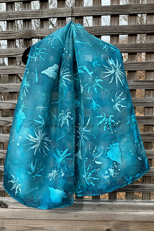 Women's turquoise blue wearable art silk scarf hand painted with abstract prints and natural leaves using the batik technique - Blue Batik