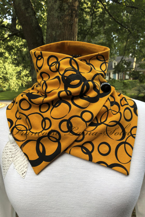 Artsy button neck warmer scarf wrap handmade with mustard yellow cotton lycra jersey and hand printed with black bubbles – Bubbles in Amber