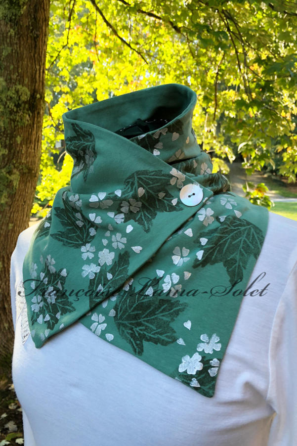 Button neck warmer scarf handmade with a sage green jersey and hand printed with green leaves and pearl cherry blossoms - Sage