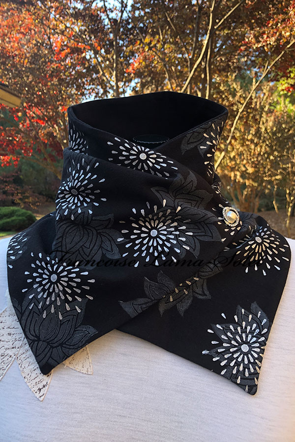 Women’s button neck warmer scarf wrap handmade with a black cotton lycra jersey and hand printed with lotus flowers and white stars - Sophia