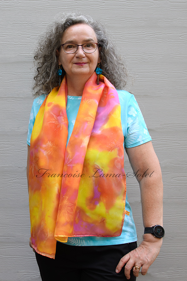 Women's wearable art lightweight silk scarf hand painted in different shades of yellow, orange and fuchsia and sun printed with leaves - Tropical Cocktail